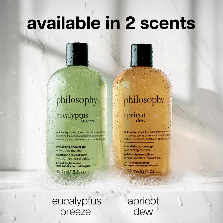 Two bottles of philosophy shower gel, one green and one orange, with text indicating scents.