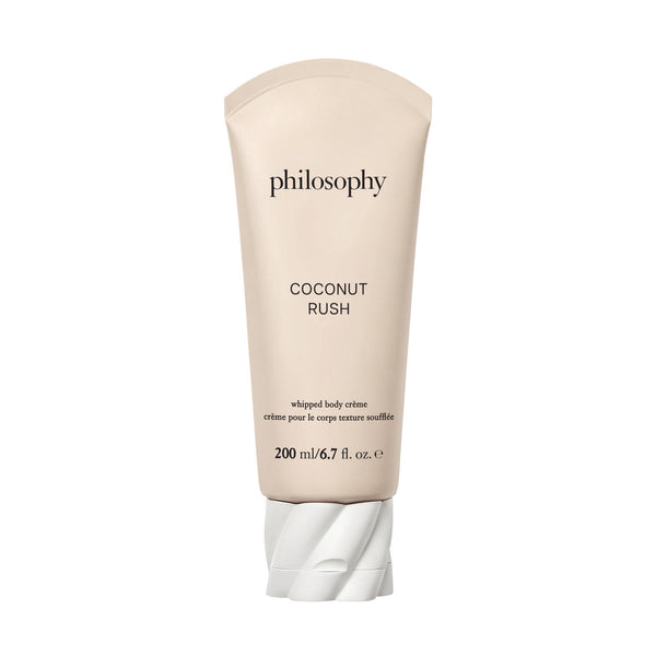 A tube of Philosophy Coconut Rush whipped body creme, 200 ml, in a light beige color with a white twisted cap, shown on a plain white background.