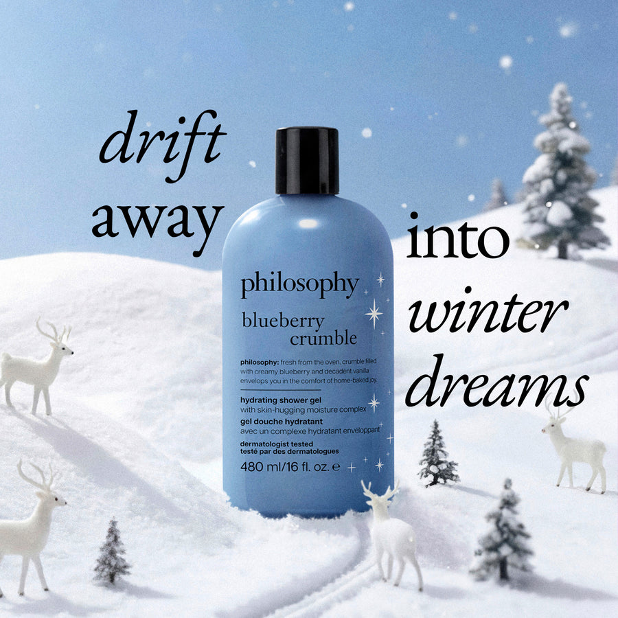 A bottle of Philosophy Blueberry Crumble Hydrating Shower Gel stands in a snowy winter landscape with deer and trees. Large text reads 'drift away into winter dreams'.