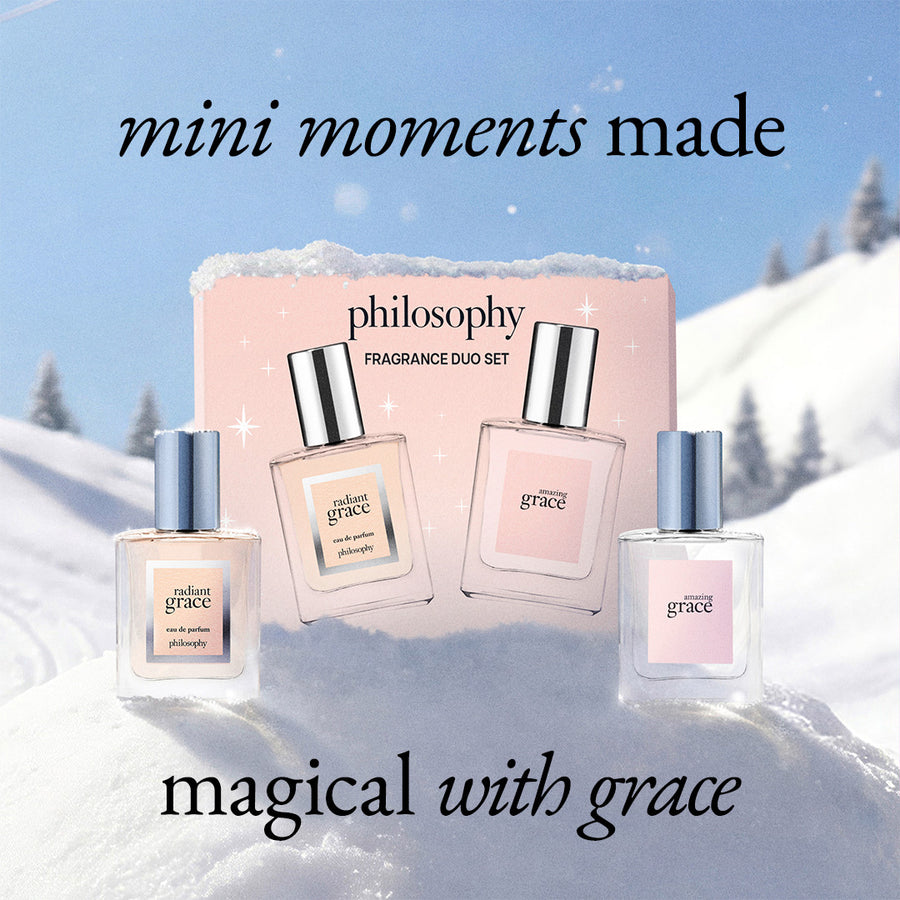 Philosophy Fragrance Duo Set featuring three mini perfume bottles and their pink packaging box, set against a snowy mountain background with the text 'mini moments made' and 'magical with grace'.